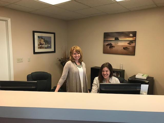 two women working in dental office